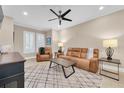 Spacious living room with leather furniture and a modern coffee table at 3817 W Dale Ave # 2, Tampa, FL 33609