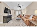 Relaxing living room, featuring leather couches and a large TV at 3817 W Dale Ave # 2, Tampa, FL 33609
