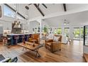 Open floor plan with spacious kitchen, island, and hardwood floors at 5906 N Kenneth Ave, Tampa, FL 33604