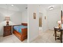 Small bedroom with a daybed and en-suite bathroom access at 628 Cleveland St # 1201, Clearwater, FL 33755
