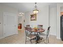 Small dining area with a table and four chairs at 628 Cleveland St # 1201, Clearwater, FL 33755