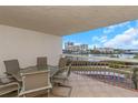 Balcony with water views and seating for six at 7893 Sailboat Key S Blvd # 304, South Pasadena, FL 33707