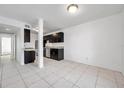Modern kitchen with dark cabinets, granite counters, and stainless steel appliances at 107 Seahorse Se Dr # A, St Petersburg, FL 33705