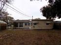 Large backyard with mature trees behind the house at 435 92Nd N Ave, St Petersburg, FL 33702