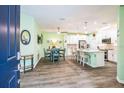 Open concept kitchen with white cabinets and island at 5914 Fiore Dr, Bradenton, FL 34208