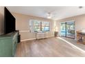 Spacious living room featuring hardwood floors and sliding glass doors at 6237 Spring Hill Dr, Spring Hill, FL 34606