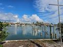 Scenic view of calm water, boat docks, and lush vegetation at 11325 6Th E St, Treasure Island, FL 33706