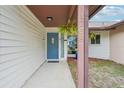 Inviting entryway with a blue door and a walkway at 1708 Dove Field Pl, Brandon, FL 33510