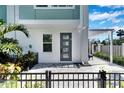 Private entrance with gray door and paved patio area at 2819 1St S Ave, St Petersburg, FL 33712