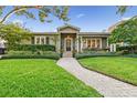 Charming one-story home with a well-maintained lawn and a brick walkway at 526 19Th Ne Ave, St Petersburg, FL 33704