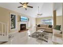 Spacious living room with a fireplace and tiled floors at 7803 Cadillac Ave, Hudson, FL 34667