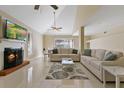 Bright living room featuring a fireplace and comfortable seating at 7803 Cadillac Ave, Hudson, FL 34667