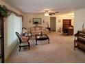 Spacious living room featuring a sofa, coffee table, and built-in hutch at 9608 41St N St # 2, Pinellas Park, FL 33782