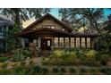 Evening view of craftsman home with landscaping and stone pathway at 106 15Th Ne Ave, St Petersburg, FL 33704