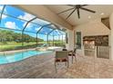 Outdoor kitchen with a grill and a view of the pool at 13819 Swiftwater Way, Bradenton, FL 34211