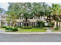 Townhome building with mature trees and landscaping at 14003 Citrus Crest Cir, Tampa, FL 33625