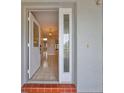 Inviting entryway with tiled floor and glass-paneled door at 1601 Woodmar Dr, Sun City Center, FL 33573