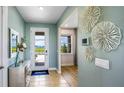 Bright entryway with tiled floors and view of backyard at 17932 Tavernside Trl, Lakewood Ranch, FL 34211