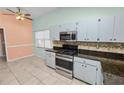 Kitchen features stainless steel appliances and granite countertops at 2115 Cattleman Dr, Brandon, FL 33511