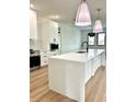 Modern kitchen featuring a large island and stainless steel appliances at 225 Tournament Rd, Rotonda West, FL 33947