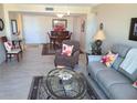 Open concept living and dining area with tiled floors at 255 Dolphin Pt # 511, Clearwater Beach, FL 33767