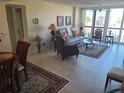 Spacious living room with tiled floors and furniture at 255 Dolphin Pt # 511, Clearwater Beach, FL 33767
