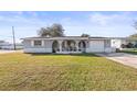 House with a spacious yard and attached garage at 3005 Matchlock Dr, Holiday, FL 34690