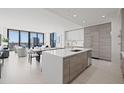 Modern kitchen with island, stainless steel appliances, and city view at 301 1St S St # 1905, St Petersburg, FL 33701