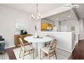 Virtually staged dining area with kitchen pass-through and chandelier at 4842 Pond Ridge Dr, Riverview, FL 33578