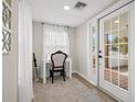 Bright and airy entryway with built-in desk and French doors at 6297 29Th N St, St Petersburg, FL 33702