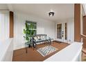 Relaxing front porch with bench and side tables at 6297 29Th N St, St Petersburg, FL 33702