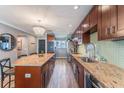 Updated kitchen boasts granite countertops and custom cabinetry at 6332 Newtown Cir # 32A1, Tampa, FL 33615