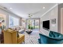 Bright living room with comfortable seating and a large TV at 6332 Newtown Cir # 32A1, Tampa, FL 33615
