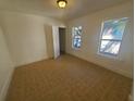 Bedroom with tile floors and two windows offering natural light at 2035 11Th S St, St Petersburg, FL 33705