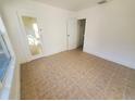 Bright bedroom featuring tile floors and ample closet space at 2035 11Th S St, St Petersburg, FL 33705