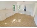 Living room with tile floors, a fireplace, and lots of natural light at 2035 11Th S St, St Petersburg, FL 33705