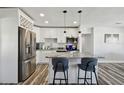 Renovated kitchen with island, stainless steel appliances, and granite countertops at 4416 W Bay Ave, Tampa, FL 33616