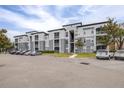 Apartment building exterior with ample parking at 5513 Legacy Crescent Pl # 303, Riverview, FL 33578