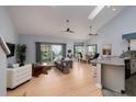 Open living space with hardwood floors, vaulted ceilings and modern furniture at 661 Segovia Ne Ct, St Petersburg, FL 33703