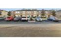 Townhome community with parking lot and building exterior at 8841 Walnut Gable Ct, Riverview, FL 33578