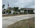 Ranch-style home with a spacious yard at 9524 Treasure Ne Ln, St Petersburg, FL 33702