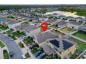 Aerial view of house with solar panels, located in a neighborhood at 12017 Gillingham Harbor Ln, Gibsonton, FL 33534