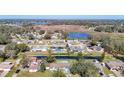Aerial view showcasing the property's location in a quiet neighborhood near a lake at 1210 Lady Elaine Dr, Valrico, FL 33594