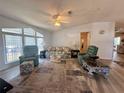 Open concept living room featuring a sofa and two armchairs at 209 N Saint Thomas Cir, Apollo Beach, FL 33572
