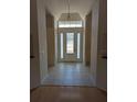 Bright entryway with tile floor and hardwood accents at 2365 Ardenwood Dr, Spring Hill, FL 34609