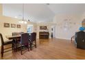 Bright dining room with hardwood floors, a wooden table and chairs at 4605 Lisette Cir, Brooksville, FL 34604