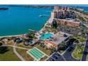 Aerial view of resort-style pool, clubhouse, and tennis/pickleball courts at 4900 Brittany S Dr # 701, St Petersburg, FL 33715