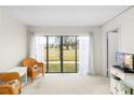 Bright living room with sliding doors leading to a view at 4920 Locust Ne St # 116, St Petersburg, FL 33703