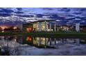 Modern community center with pond reflection at dusk at 5289 Everlong Dr, Apollo Beach, FL 33572