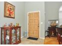 Bright entryway with hardwood floors and decorative accents at 5581 Salem Square S Dr, Palm Harbor, FL 34685